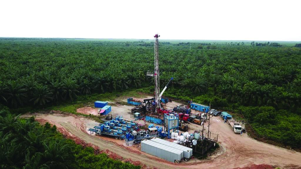 Workover rig on a plantation well site